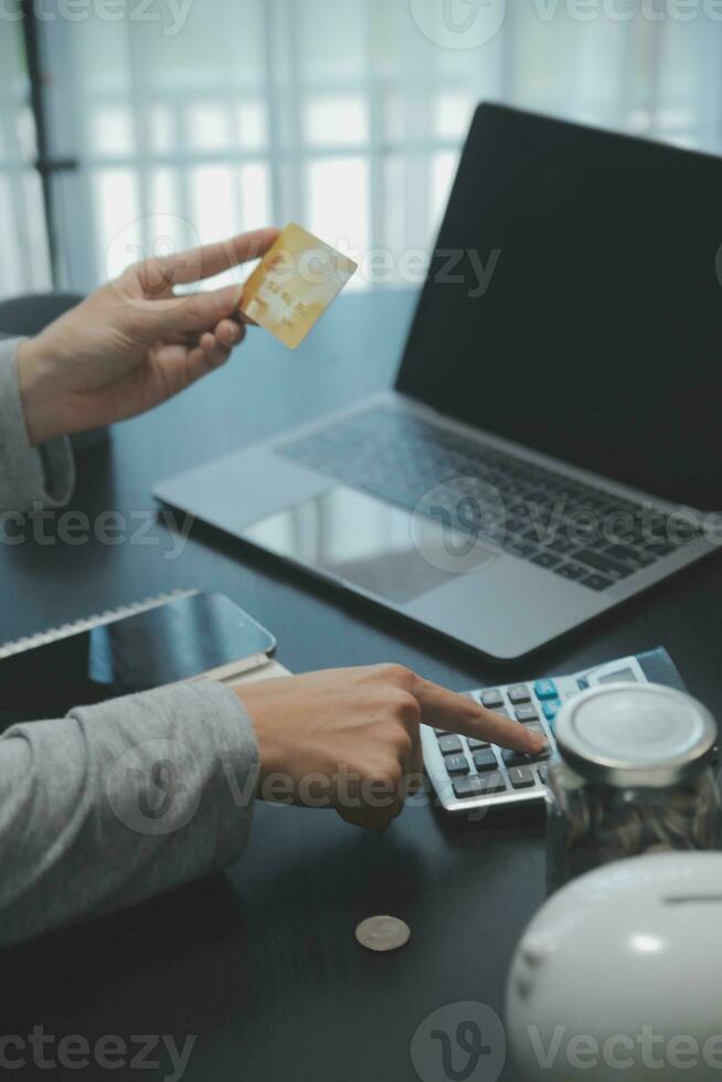 Close up woman hands holding using cradit card for shopping online. photo