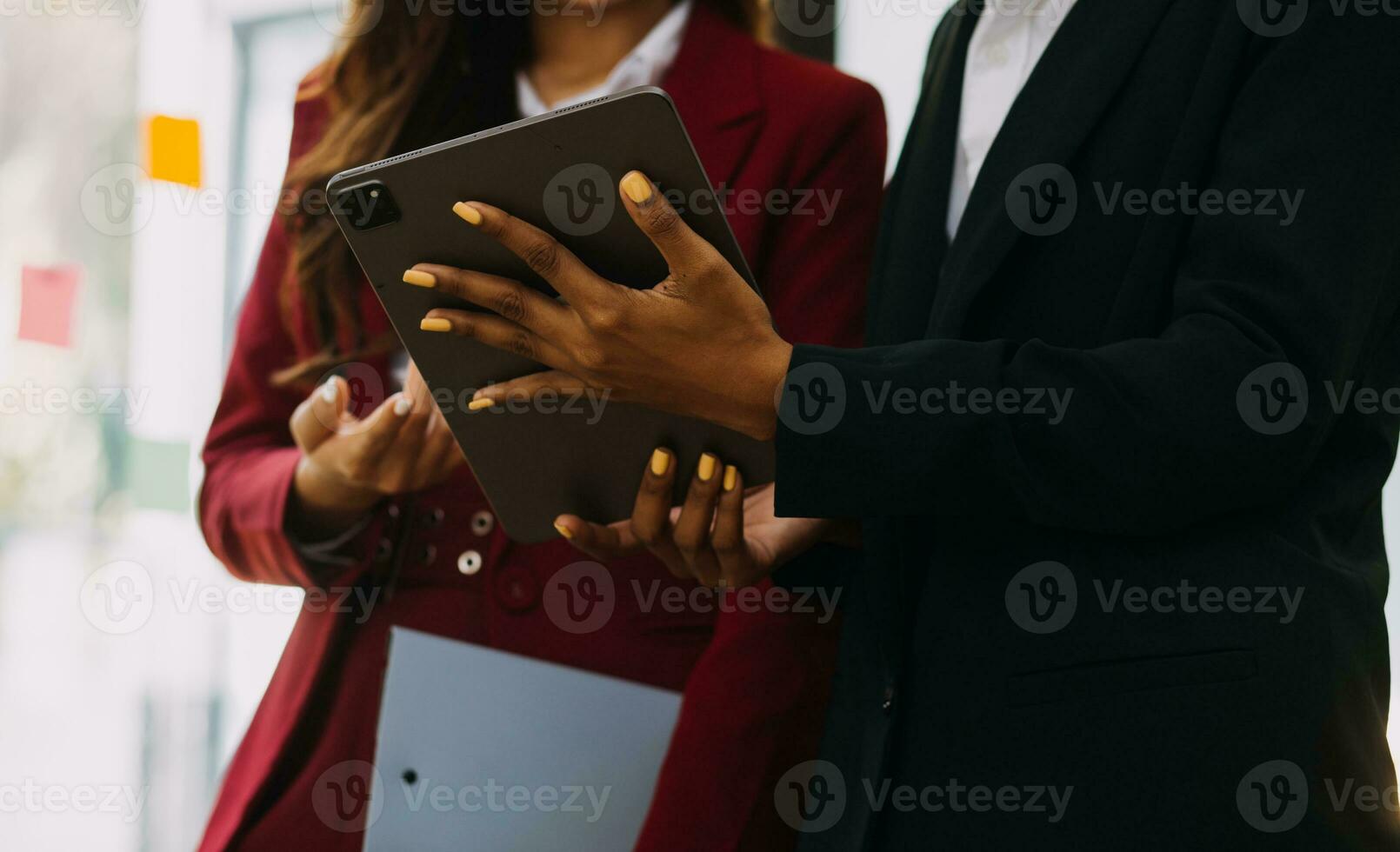 Asian Business woman using calculator and laptop for doing math finance on an office desk, tax, report, accounting, statistics, and analytical research concept photo