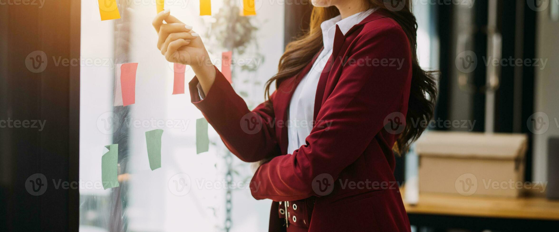 Asian Business woman using calculator and laptop for doing math finance on an office desk, tax, report, accounting, statistics, and analytical research concept photo