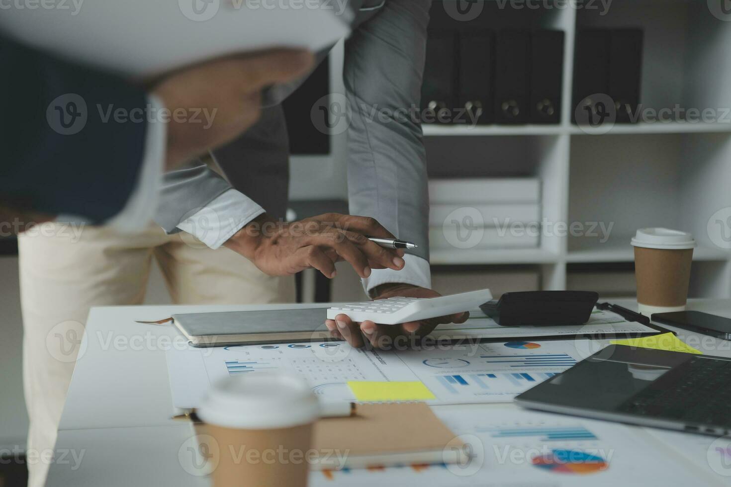 Financial analysts analyze business financial reports on a digital tablet planning investment project during a discussion at a meeting of corporate showing the results of their successful teamwork. photo