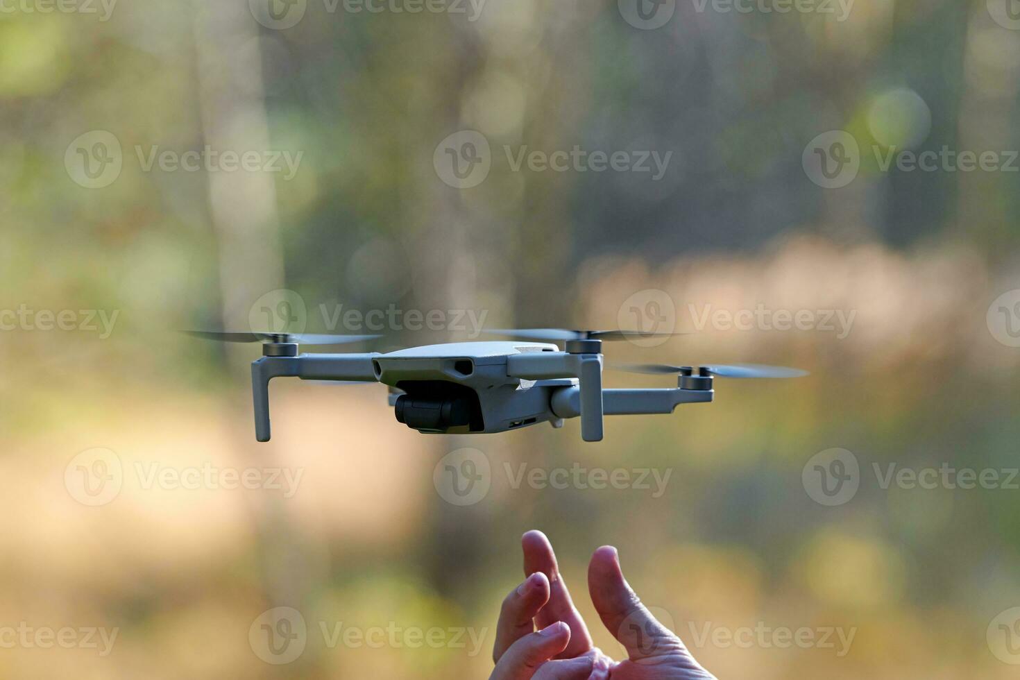 Quadcopter drone on operator hand photo