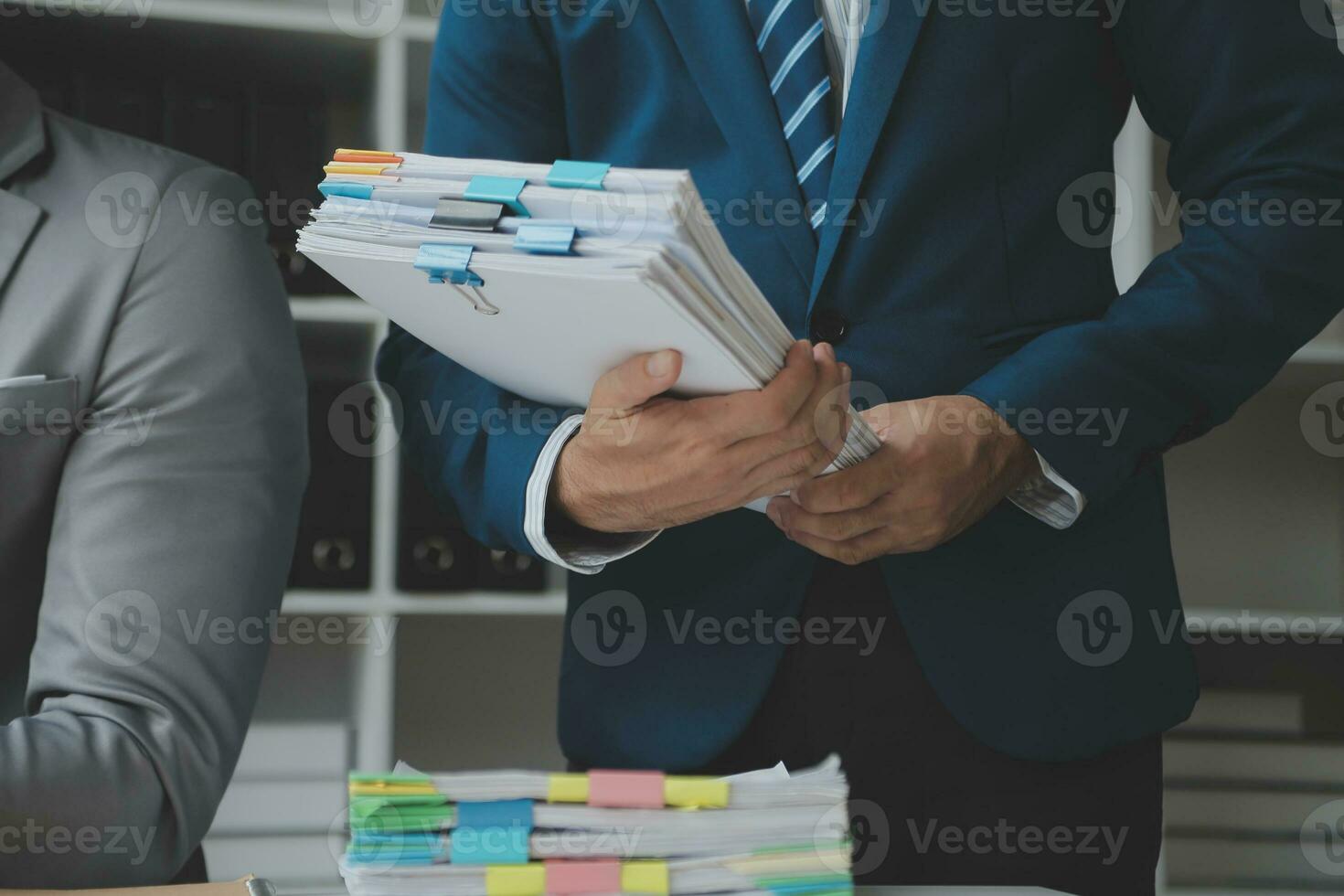 Financial analysts analyze business financial reports on a digital tablet planning investment project during a discussion at a meeting of corporate showing the results of their successful teamwork. photo