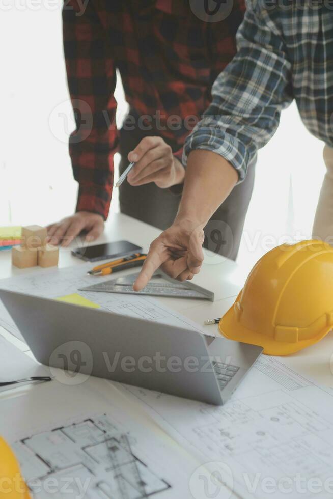 Construction and structure concept of Engineer or architect meeting for project working with partner and engineering tools on model building and blueprint in working site, contract for both companies. photo