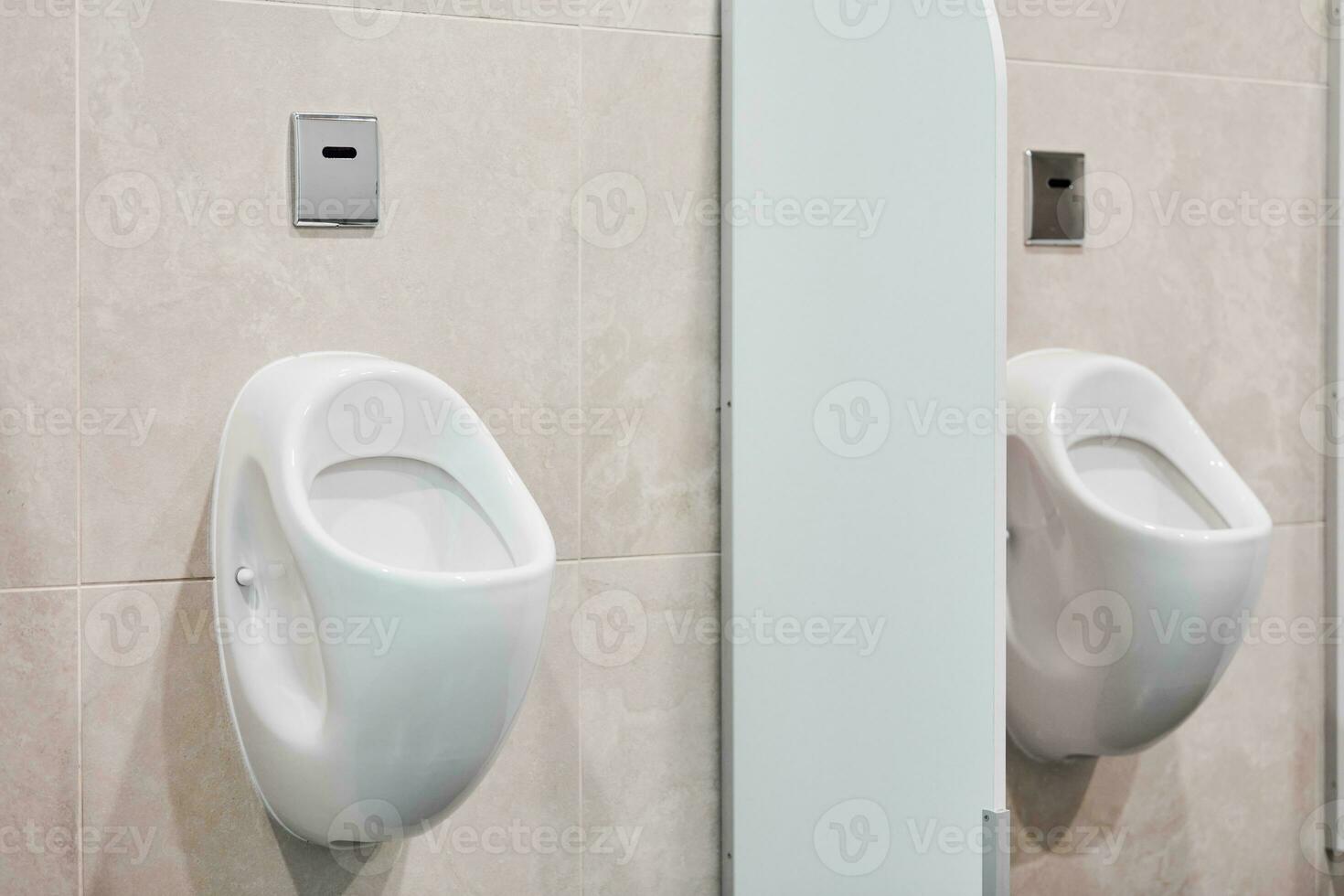 Urinal in public men toilet photo
