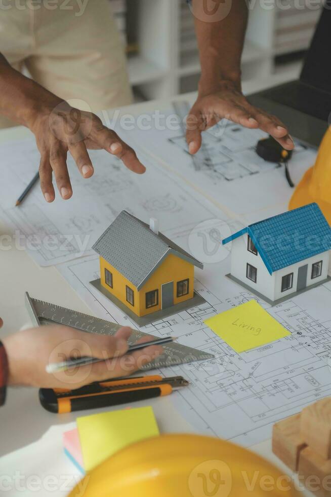 Construction and structure concept of Engineer or architect meeting for project working with partner and engineering tools on model building and blueprint in working site, contract for both companies. photo