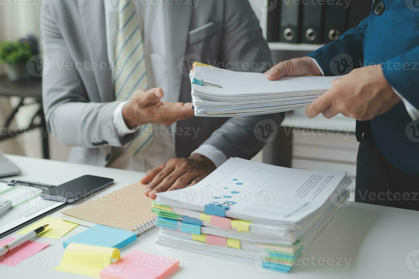 Financial analysts analyze business financial reports on a digital tablet planning investment project during a discussion at a meeting of corporate showing the results of their successful teamwork. photo