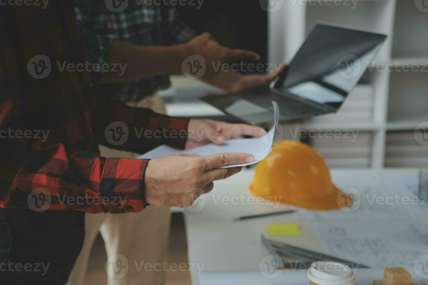 Construction and structure concept of Engineer or architect meeting for project working with partner and engineering tools on model building and blueprint in working site, contract for both companies. photo