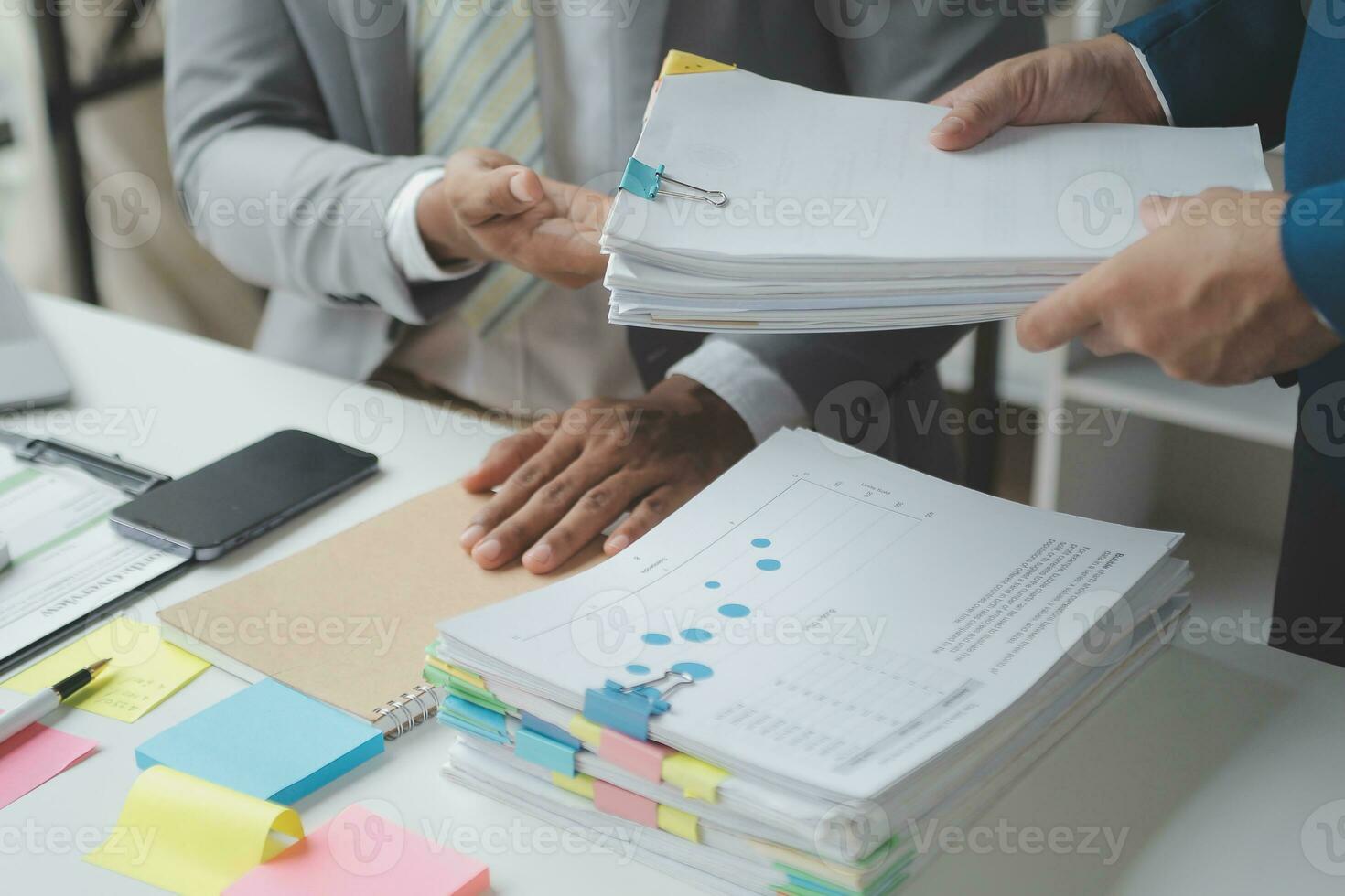 Financial analysts analyze business financial reports on a digital tablet planning investment project during a discussion at a meeting of corporate showing the results of their successful teamwork. photo