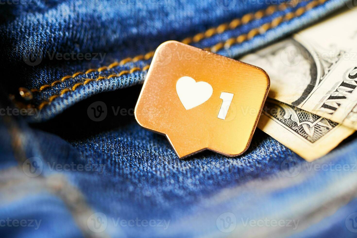 Like heart symbol and dollar in jeans pocket photo