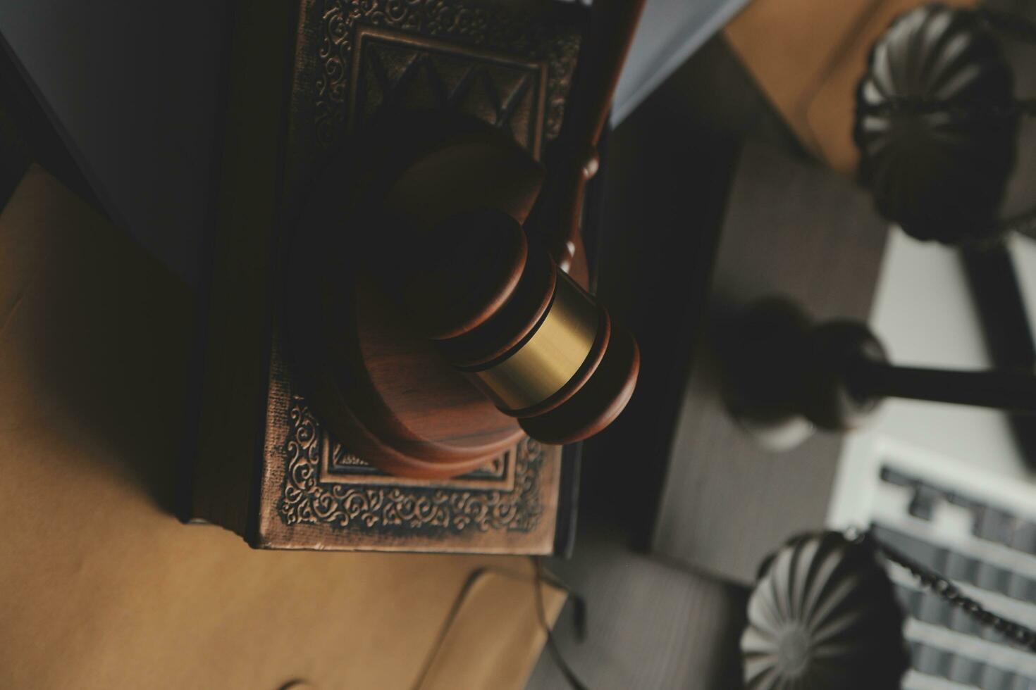 Business and lawyers discussing contract papers with brass scale on desk in office. Law, legal services, advice, justice and law concept picture with film grain effect photo