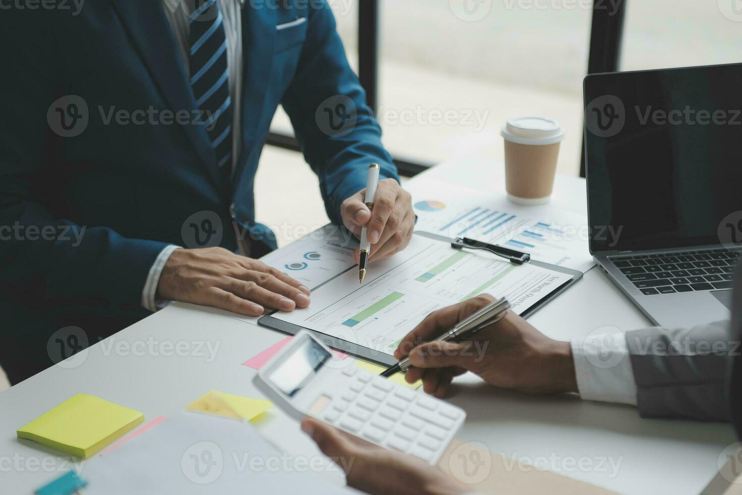 Audit concept,Administrator business man financial inspector and secretary making report calculating balance. Internal Revenue Service checking document. photo