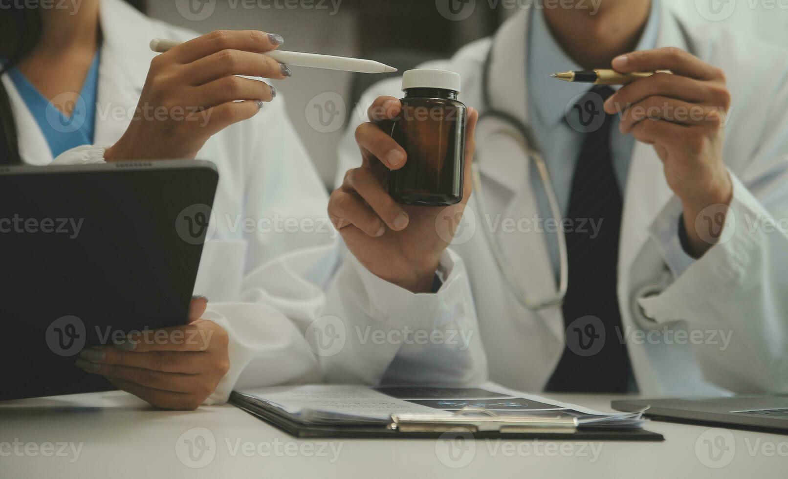 Doctor who records a patient's detailed information or medication history is evaluating medications and vaccines for the intended treatment. or if there are any side effects. photo