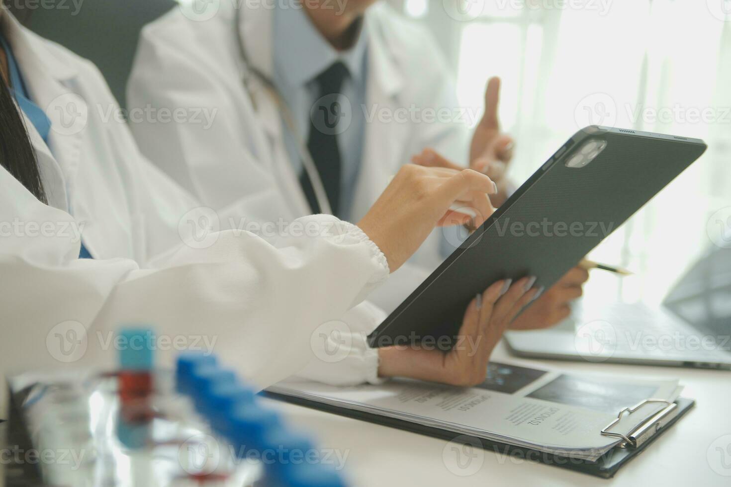 Doctor who records a patient's detailed information or medication history is evaluating medications and vaccines for the intended treatment. or if there are any side effects. photo