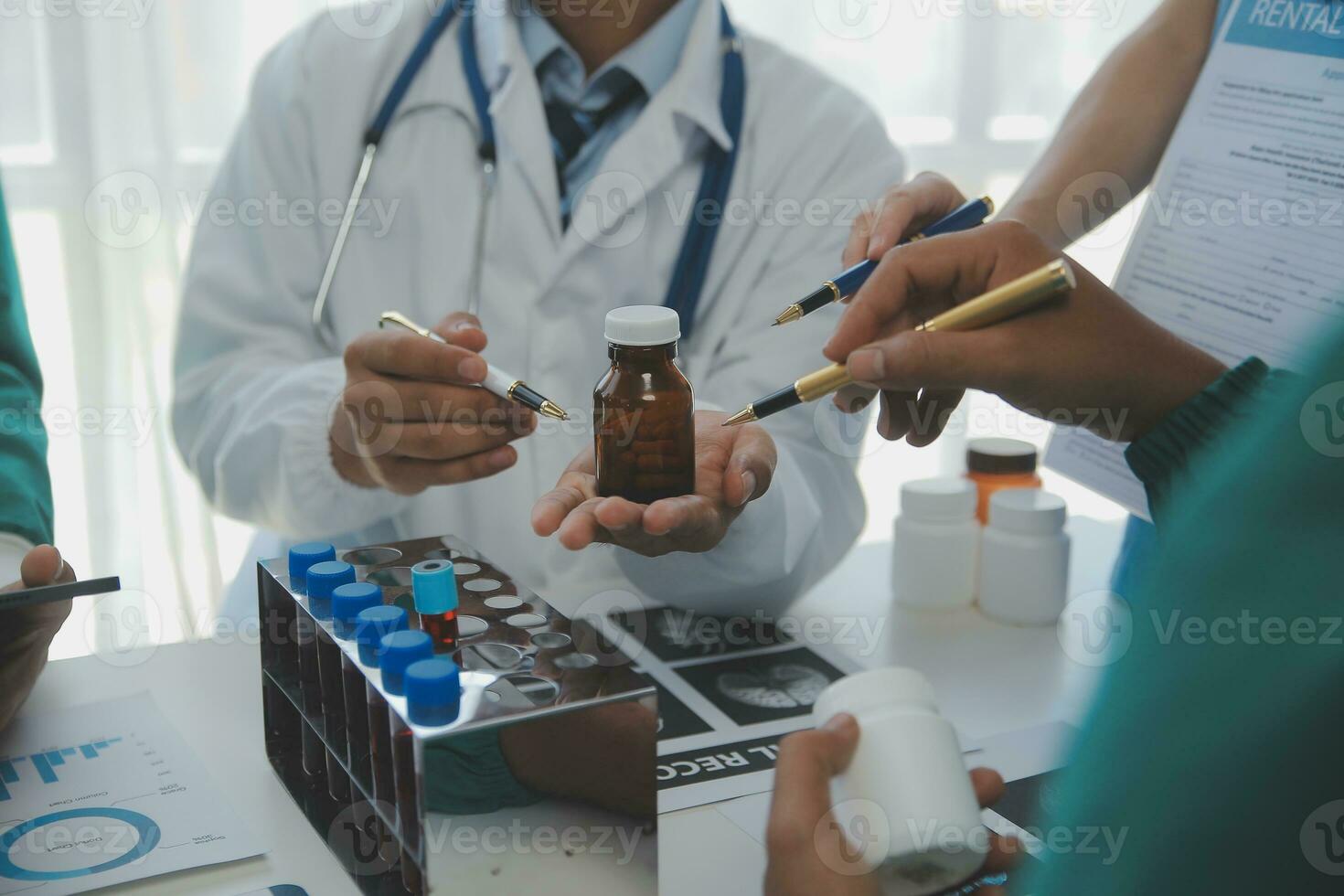 Medical technology network team meeting concept. Doctor hand working smart phone modern digital tablet laptop computer graphics chart interface, sun beams effect photo