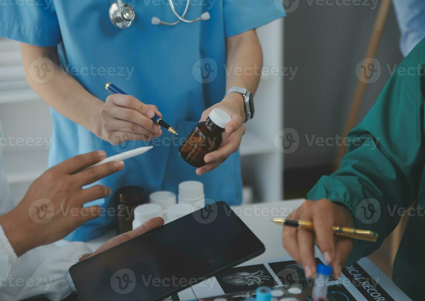 Cropped image of successful medical doctors discussing diagnosis during the conference photo