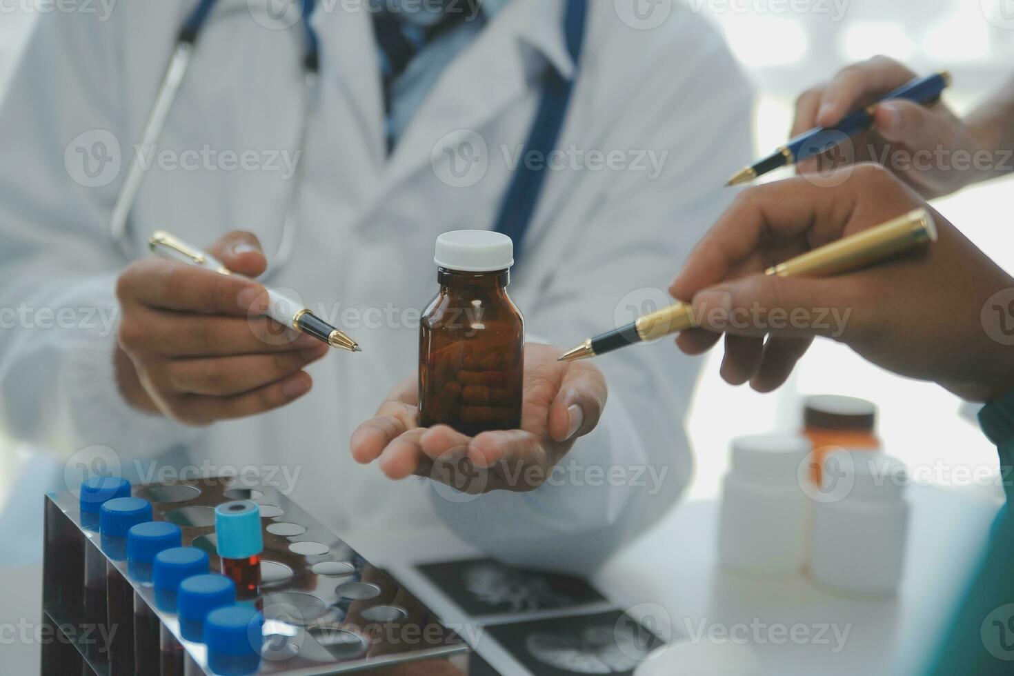 Cropped image of successful medical doctors discussing diagnosis during the conference photo