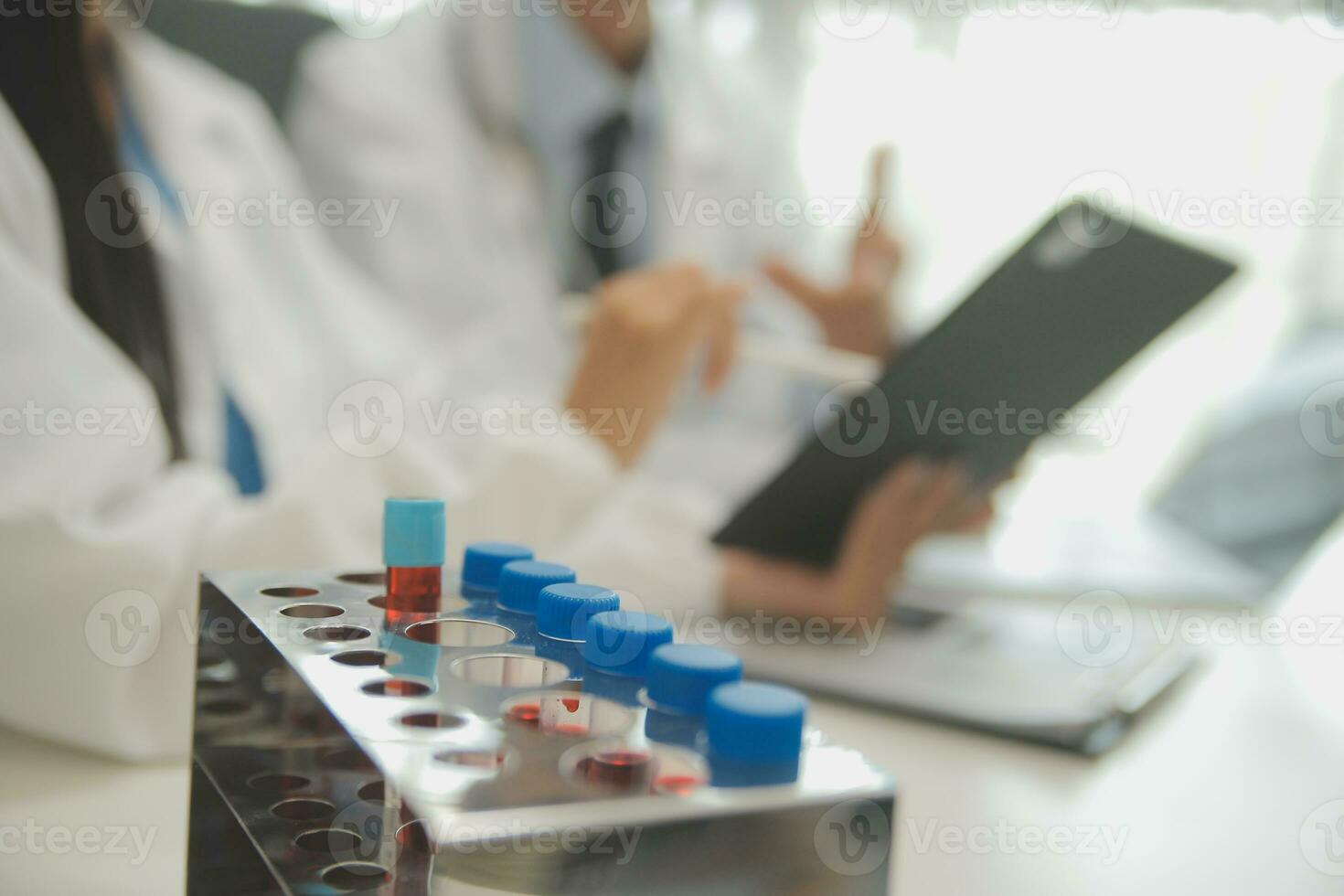 Shot of a female doctor working on medical expertise while sitting at desk in front of laptop. photo