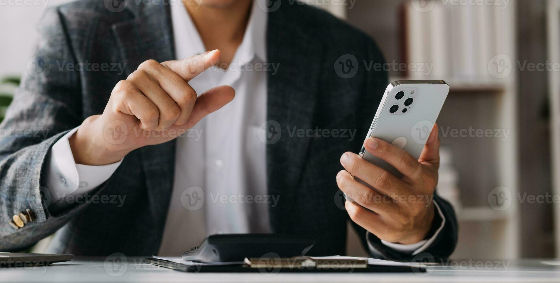 Businessman working on a laptop computer to document management online documentation database digital file storage system software records keeping database technology file access doc sharing. photo