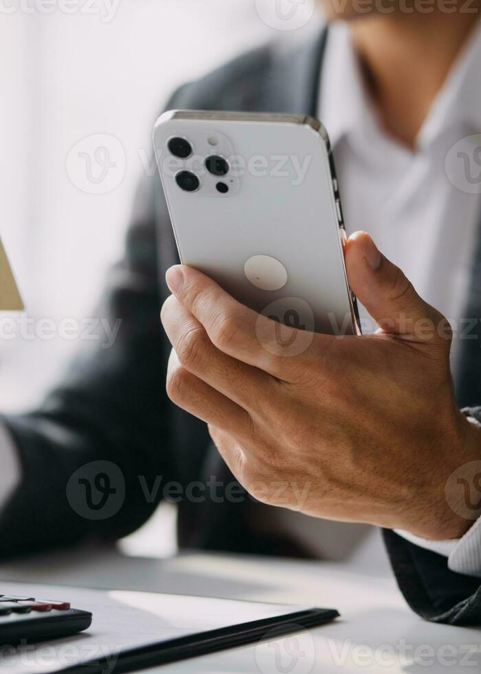 Businessman working on a laptop computer to document management online documentation database digital file storage system software records keeping database technology file access doc sharing. photo