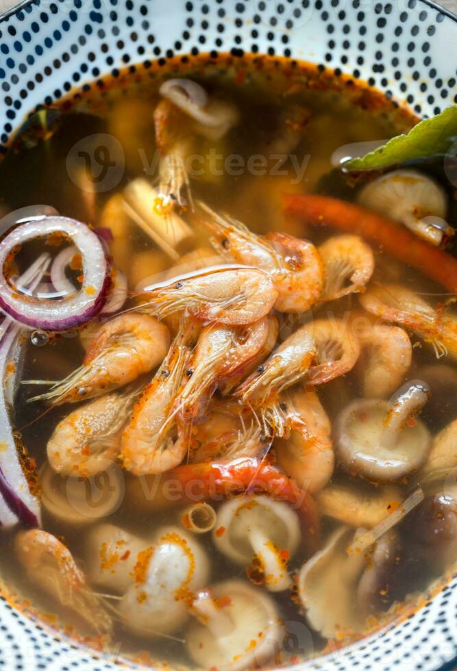 Bowl of thai tom yum soup photo