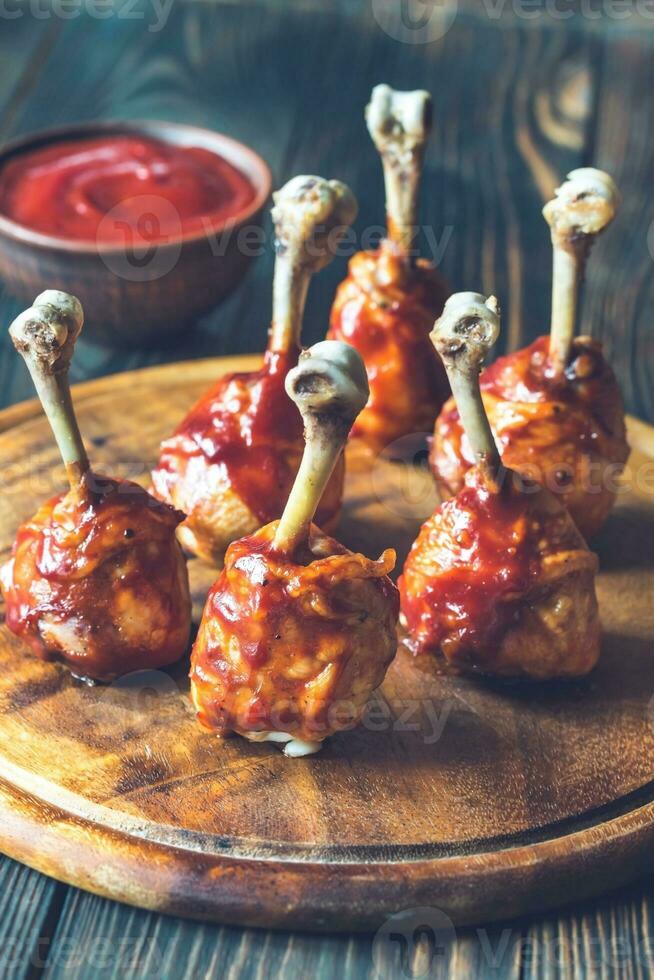 Chicken drumsticks in barbecue sauce photo