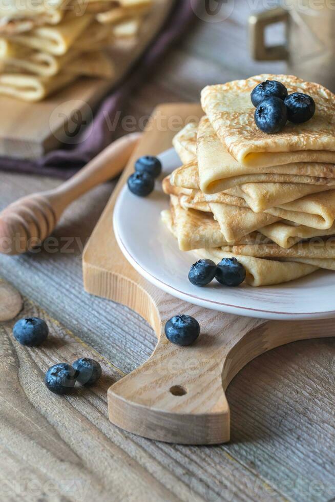 Crepes with fresh blueberries and honey photo