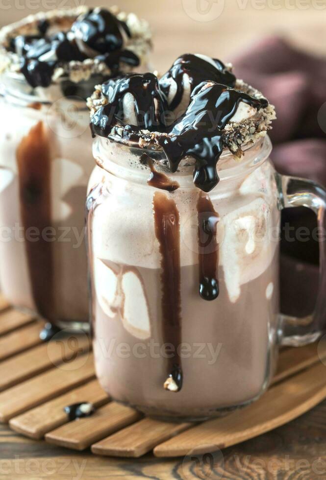 Two mugs of hot chocolate with marshmallows photo