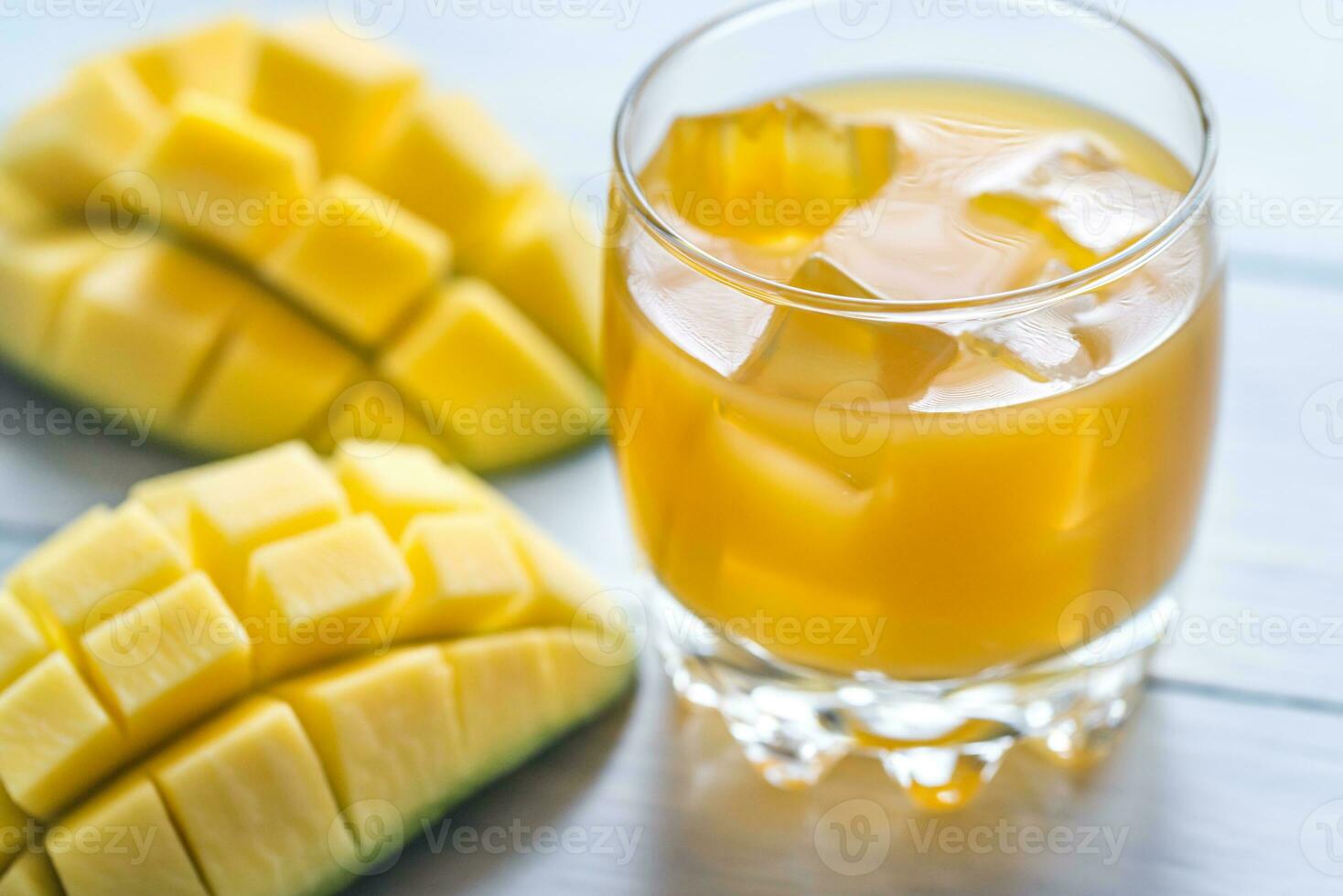 Mango juice on the wooden table photo