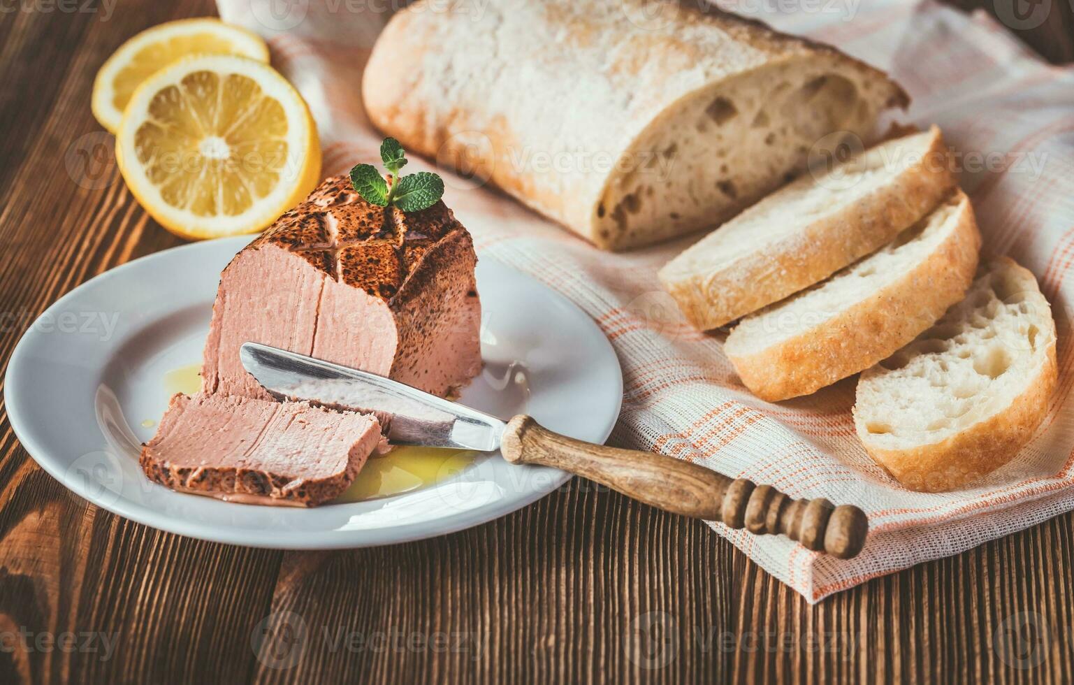 Chicken liver pate on the white plate photo