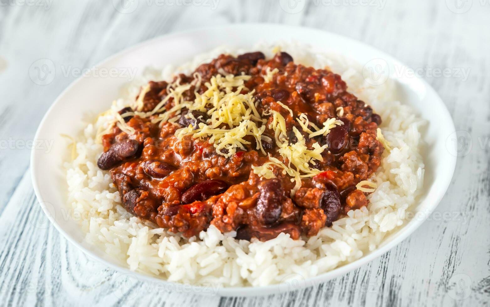 Chili con carne served with white rice photo