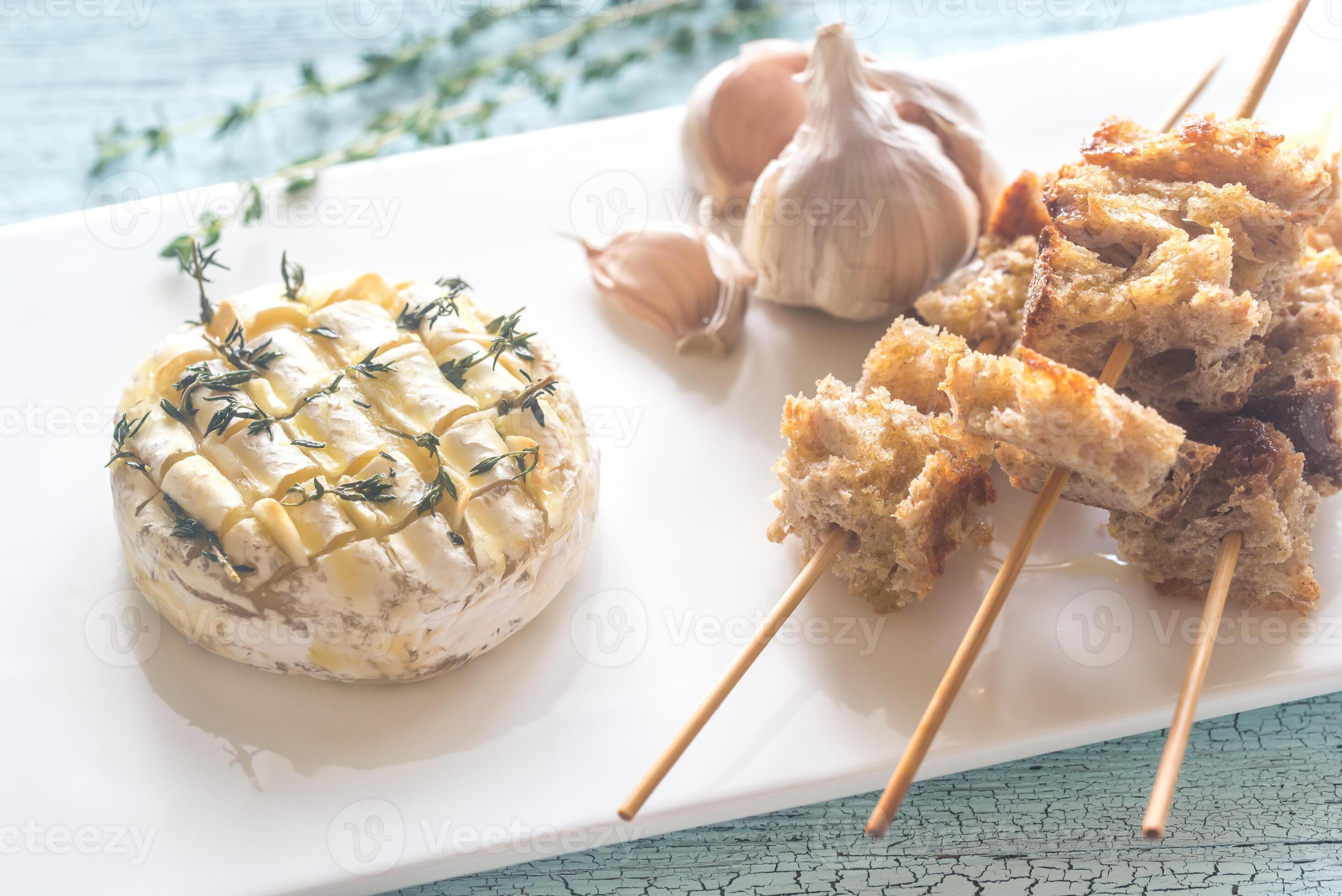 Camembert cheese fondue with toasted bread 26523441 Stock Photo at Vecteezy