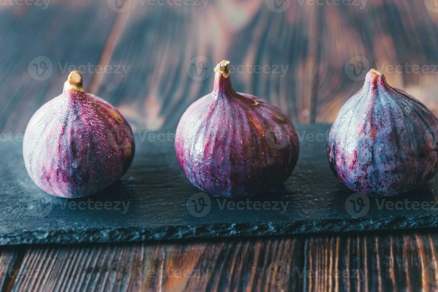 Fresh figs on the stone board photo