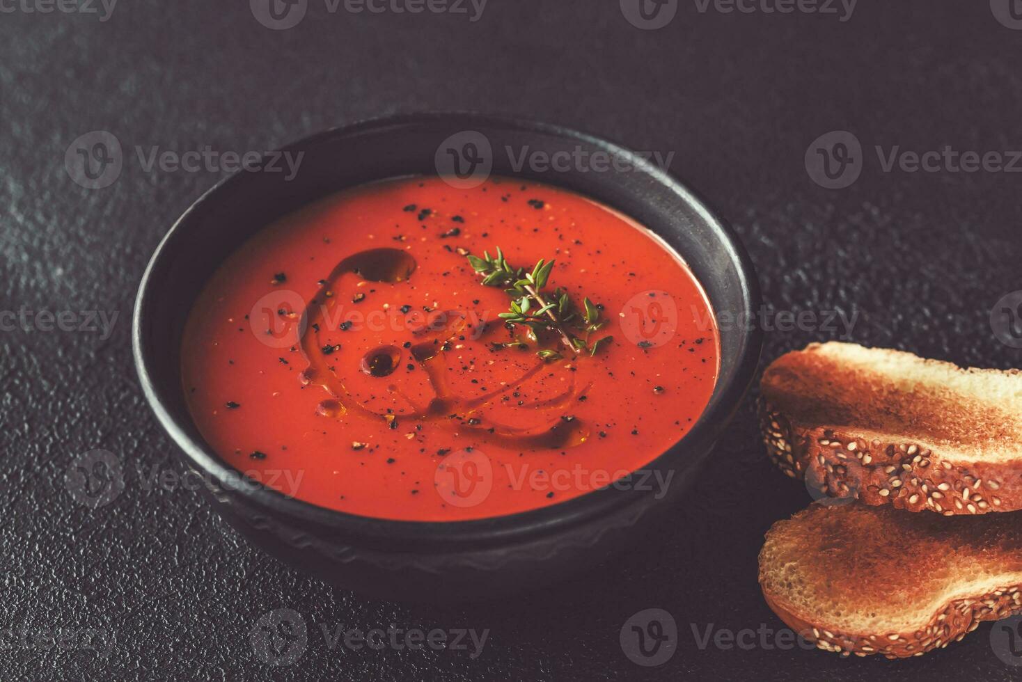 Bowl of spicy tomato soup photo