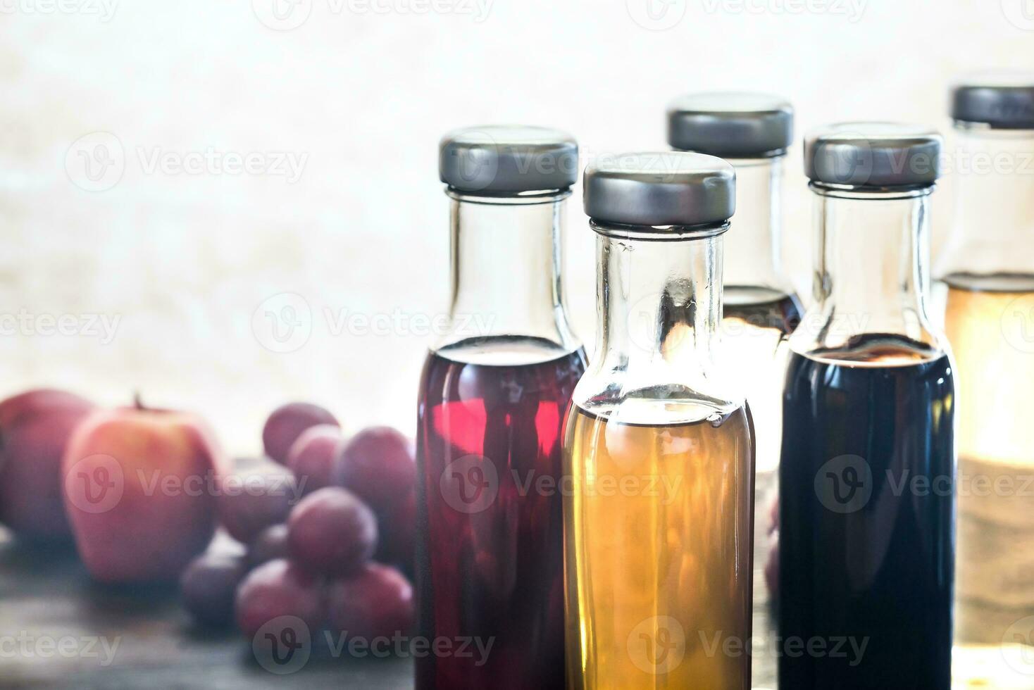 Bottles with different kinds of vinegar photo