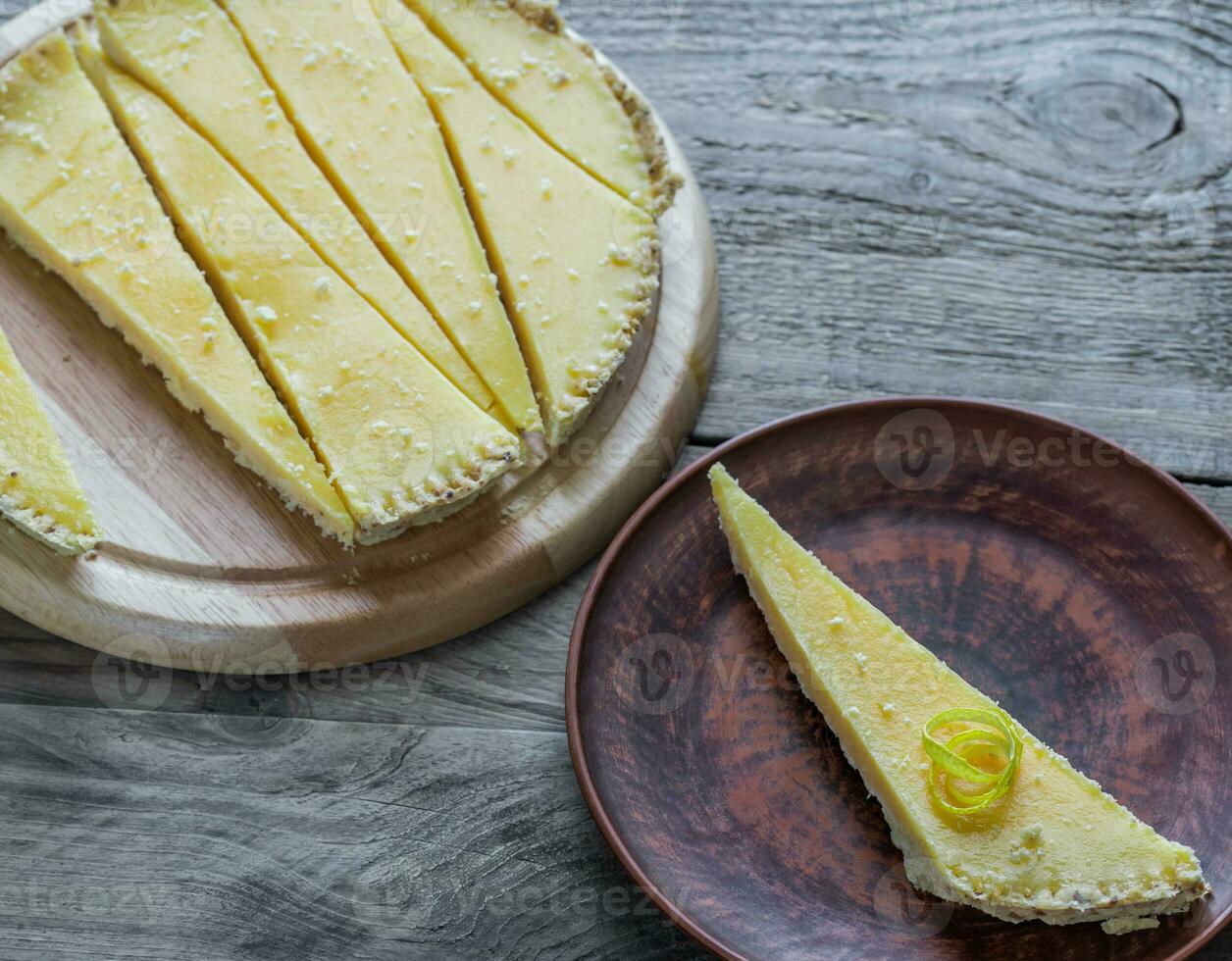 Portion of lemon tart on the plate photo