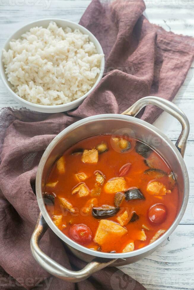 Thai red chicken curry with white rice photo