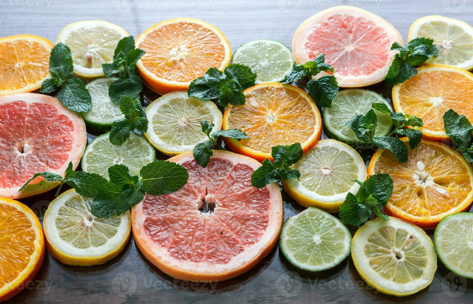 Slices of citrus fruits photo