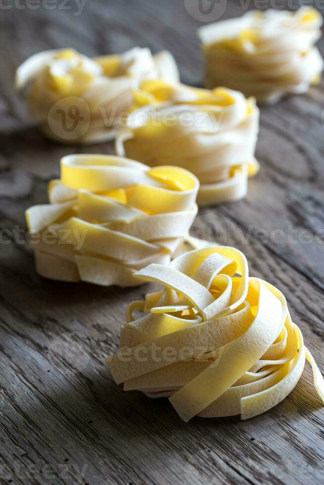 Raw fettuccine pasta photo