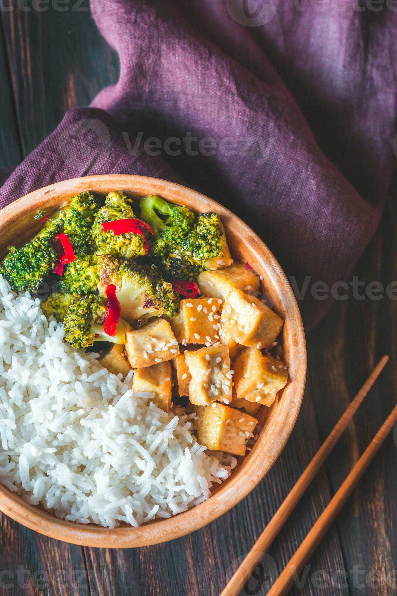 Tofu and broccoli stir-fry with white rice 26524178 Stock Photo at Vecteezy