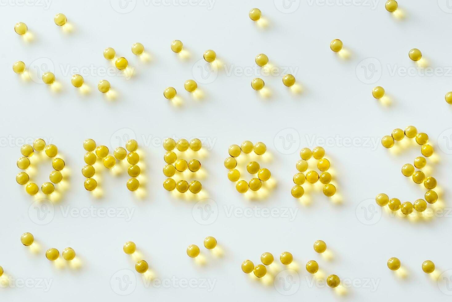 Omega-3 fish oil capsules on the white background photo