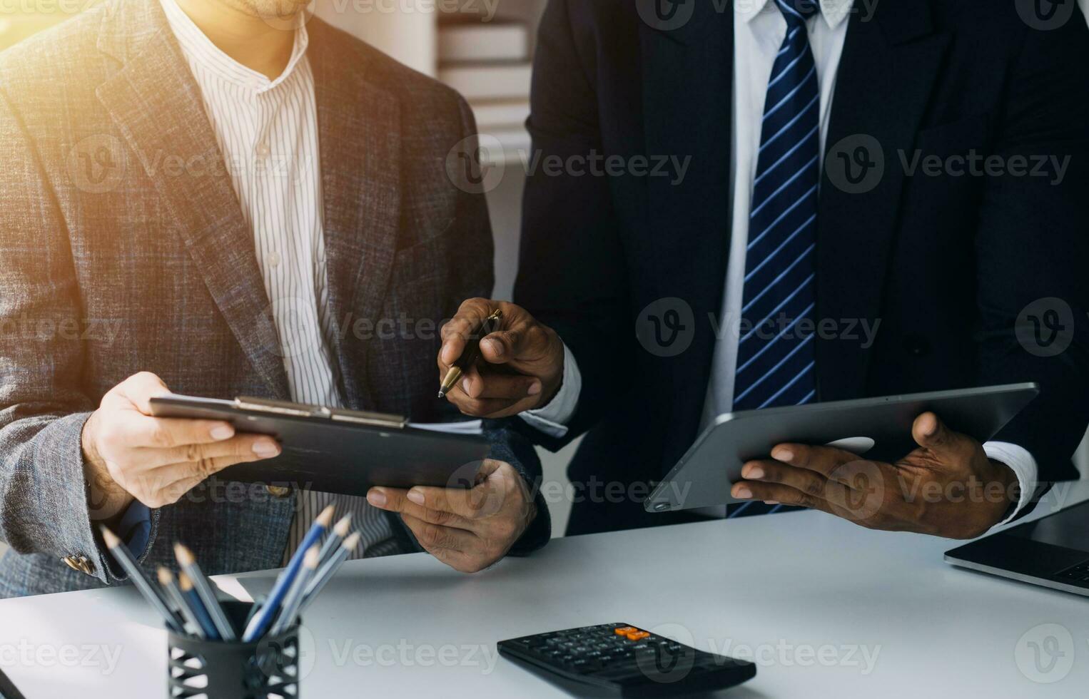 Businessman working on a laptop computer to document management online documentation database digital file storage system software records keeping database technology file access doc sharing. photo