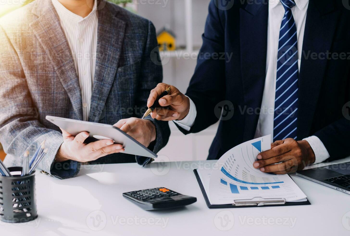 Businessman working on a laptop computer to document management online documentation database digital file storage system software records keeping database technology file access doc sharing. photo
