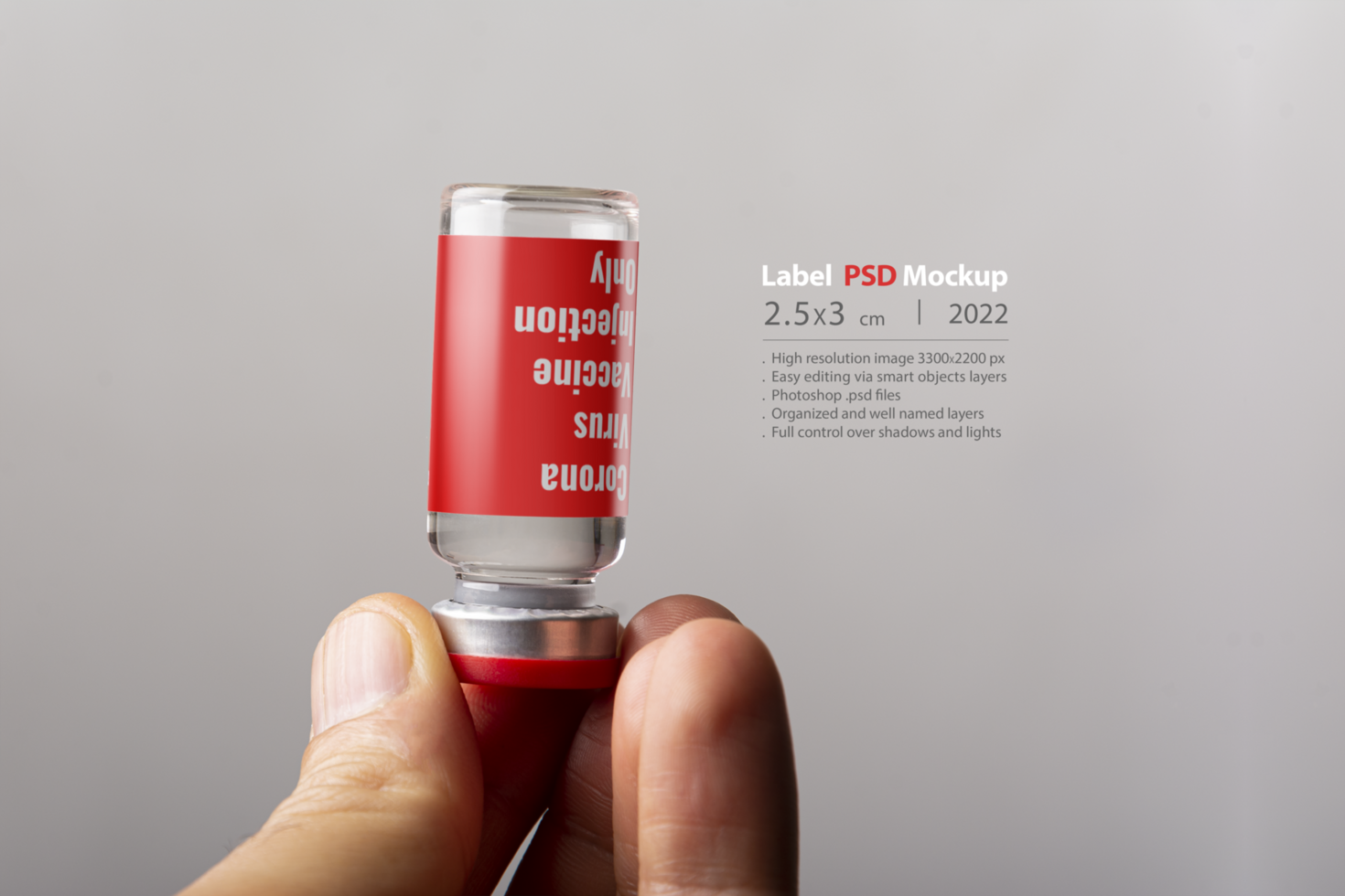 A male hand holding an injection vial psd