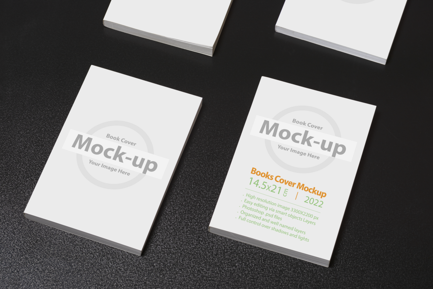 Multiple books with blank cover on dark glossy table psd