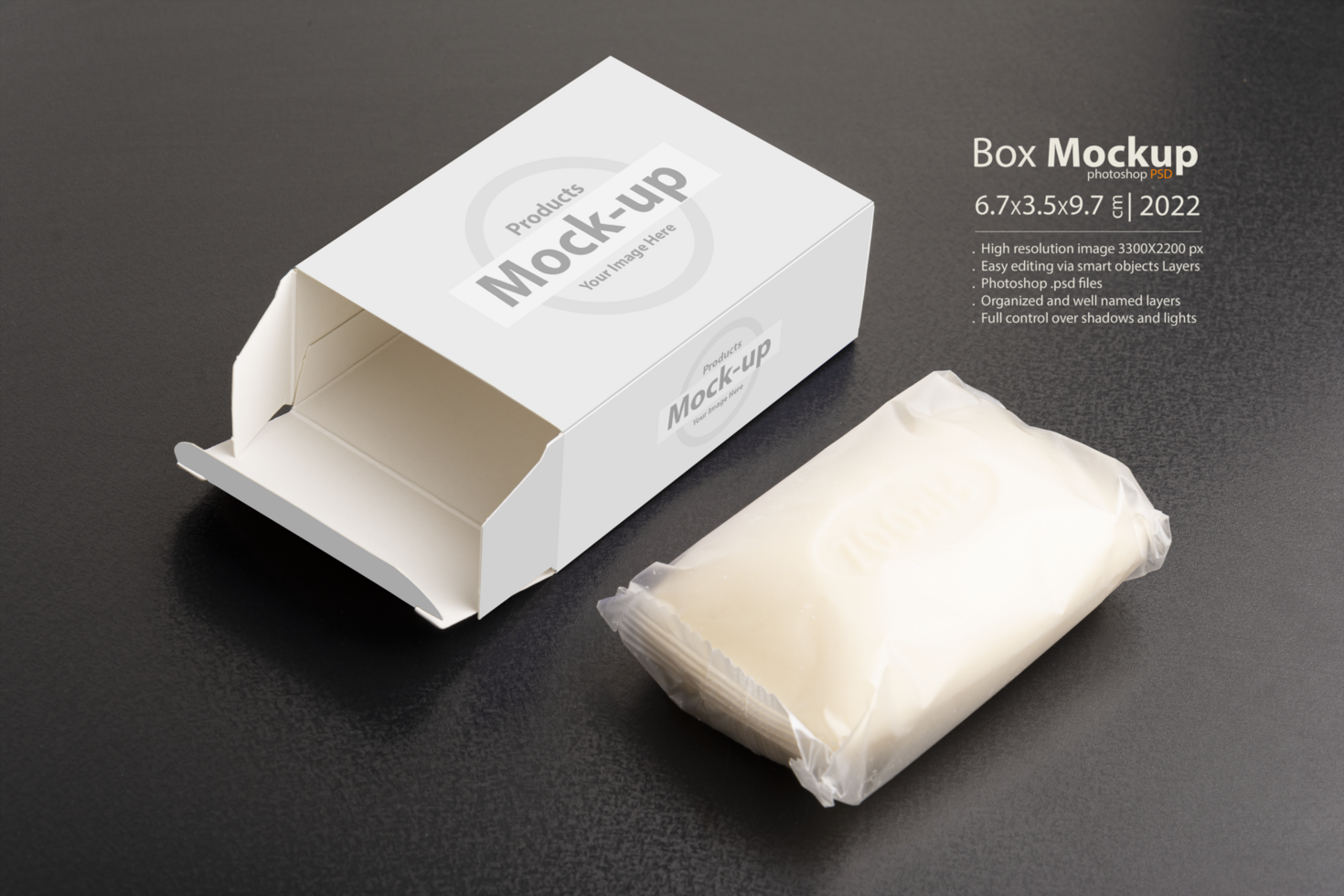 Opened soap package box on black surface psd