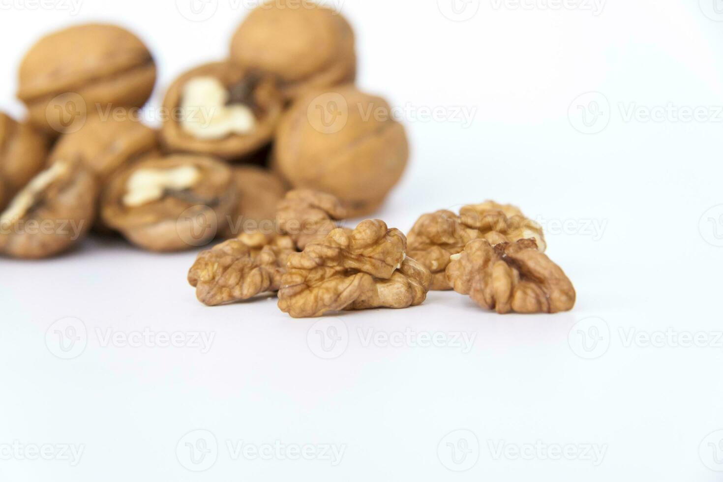 Walnuts in a shell on a white background. Healthy nuts. photo