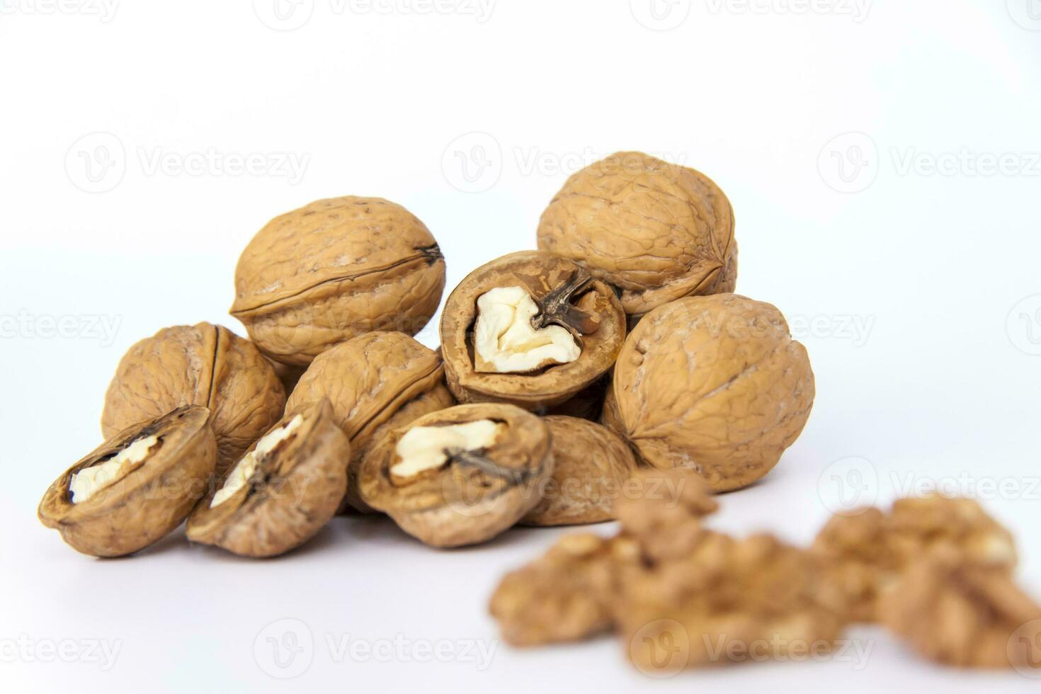 Walnuts in a shell on a white background. Healthy nuts. photo