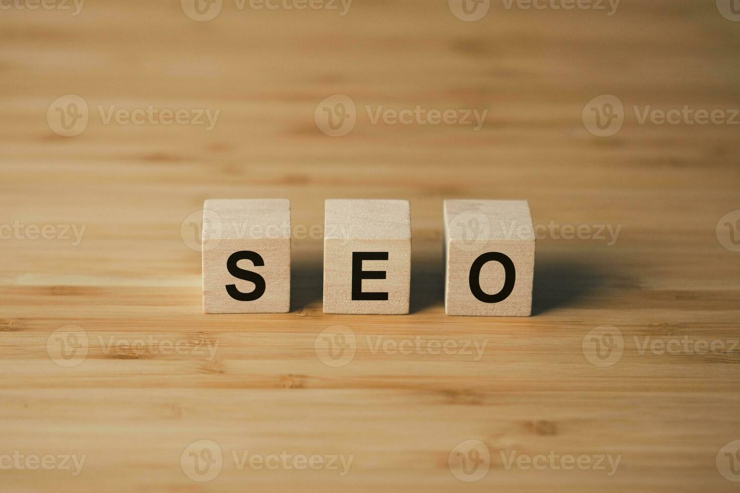 SEO Search Engine Optimization wooden cube block on wooden table. business strategy and marketing  concept photo