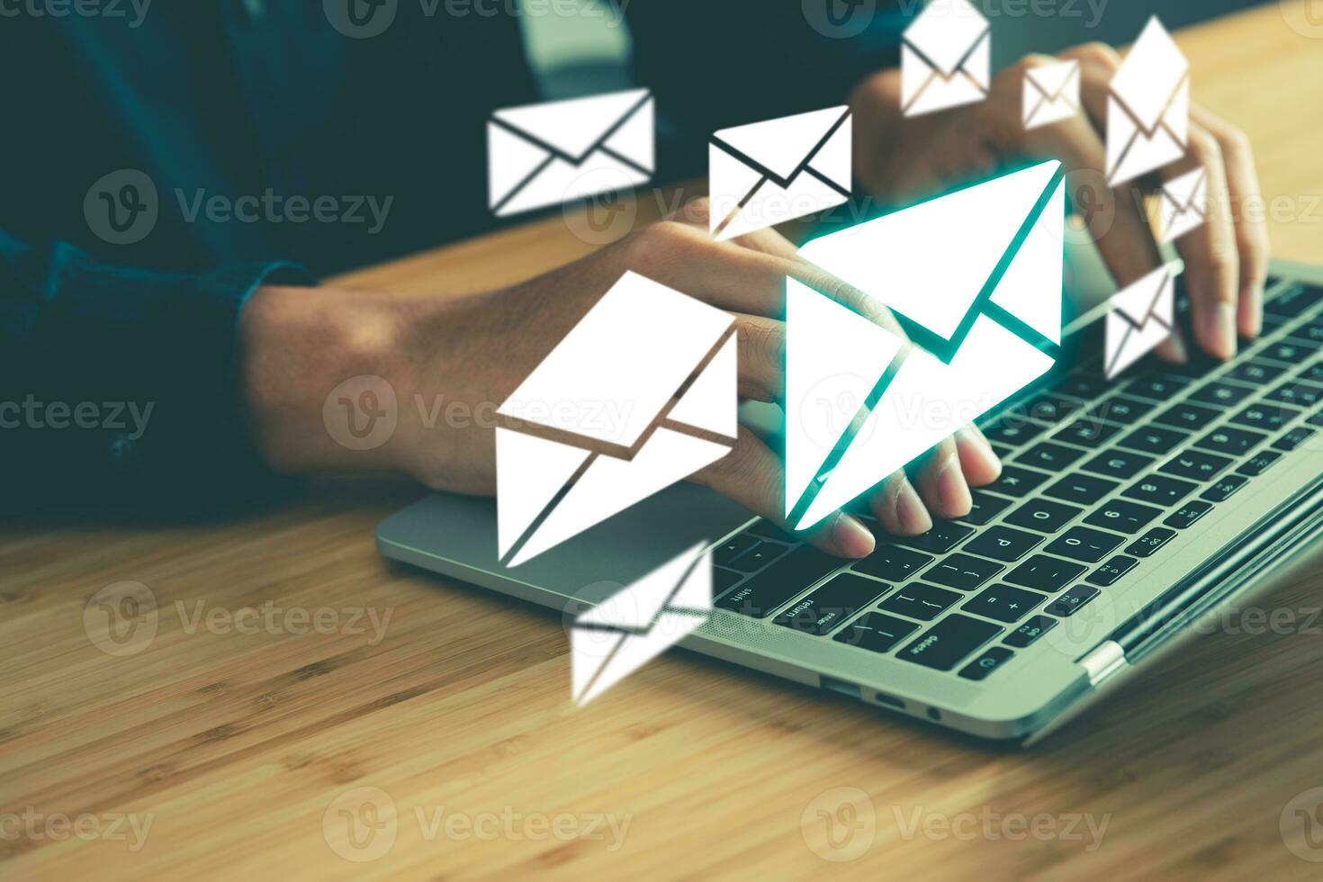 Businessman typing the laptop with envelopes icons above. Email messages, communication, digital Information technology and network concept. photo