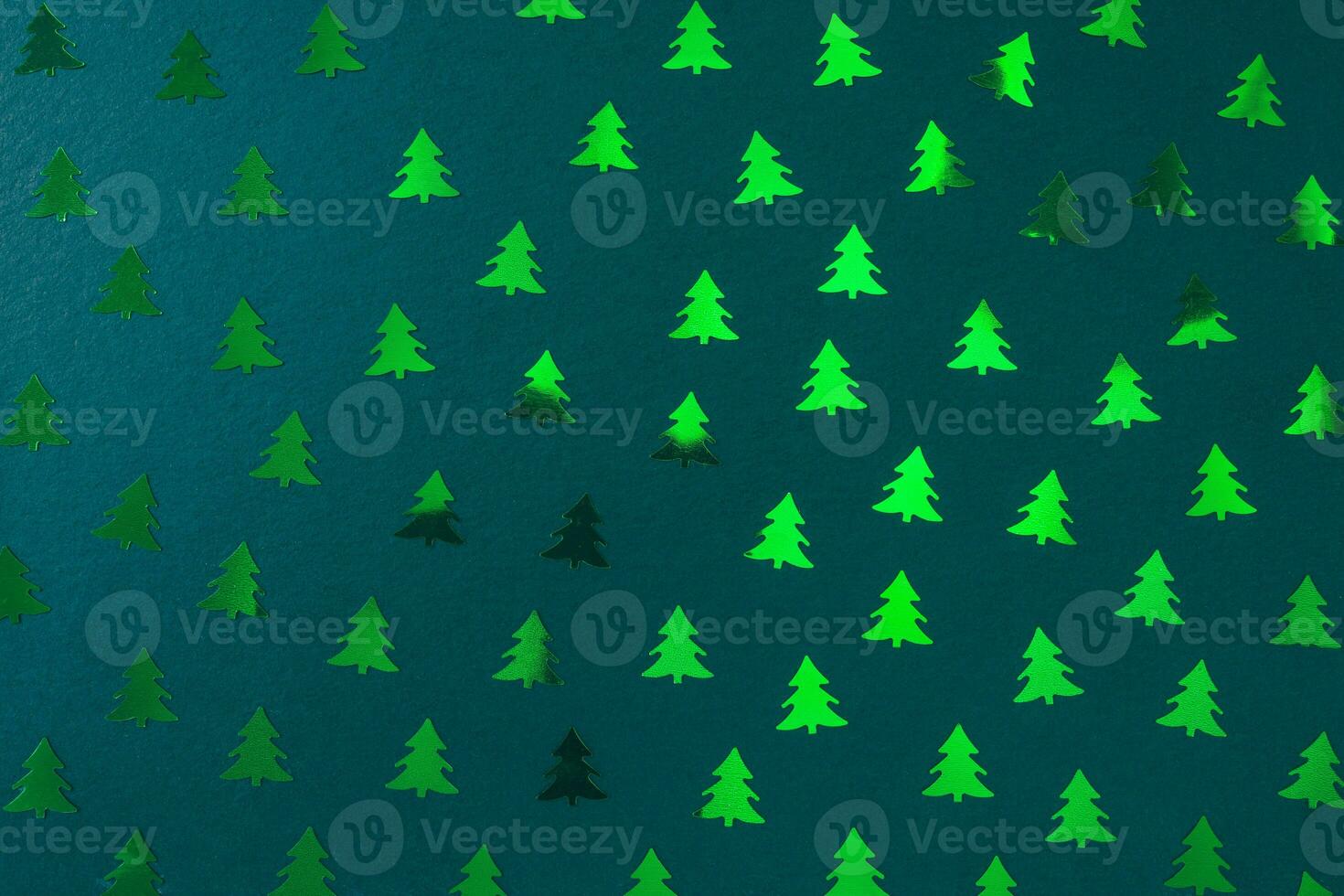 Christmas tree decoration pattern on green. Christmas abstract background photo
